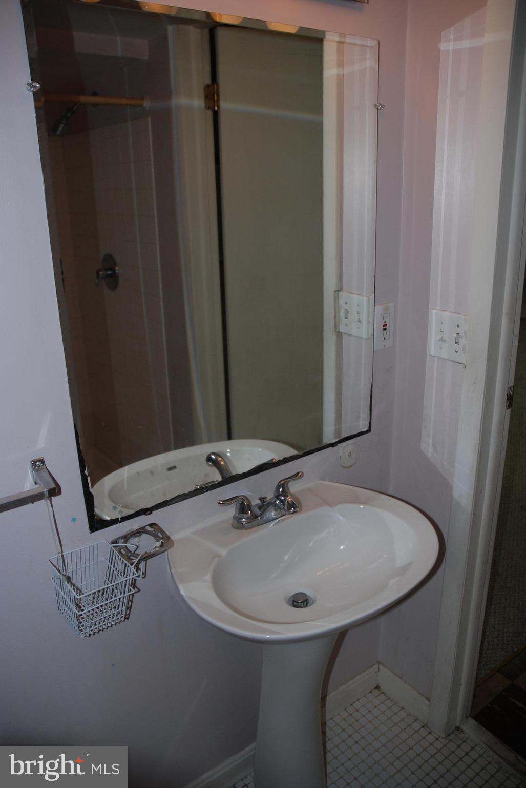 12603 Bluhill Road Silver Spring, MD 20906 - Photo 17 of 21 a bathroom with a sink and mirror