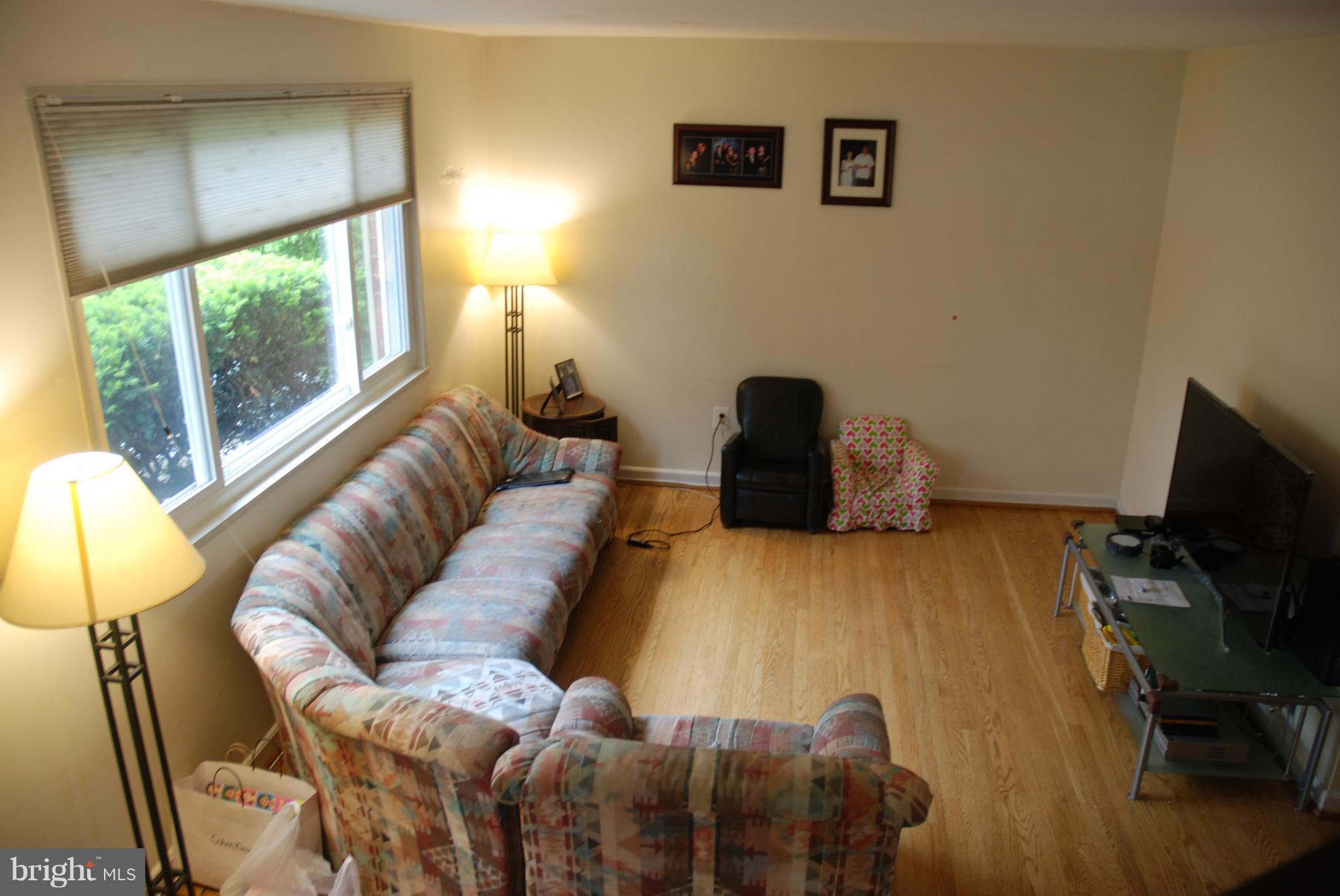12603 Bluhill Road Silver Spring, MD 20906 - Photo 5 of 21 a bedroom with a bed and wooden floor