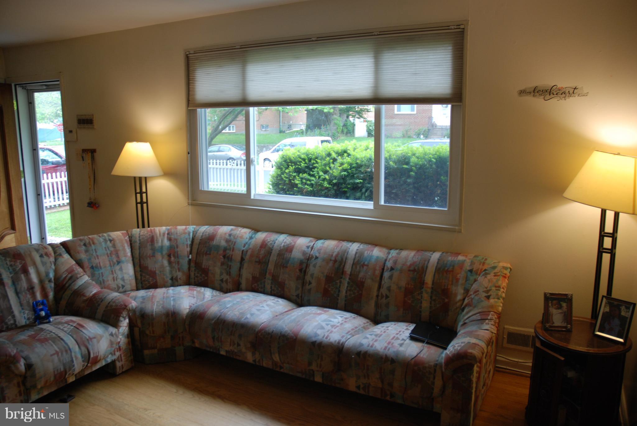 12603 Bluhill Road Silver Spring, MD 20906 - Photo 6 of 21 a living room with furniture and a window