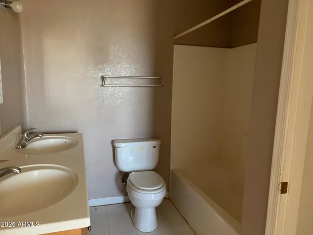 a bathroom with a toilet and a sink
