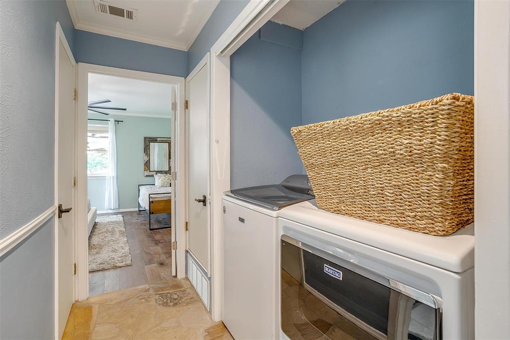 520 Deer Trail Gordon, TX 76453 - Photo 20 of 40 Washroom featuring crown molding and washing machine and dryer