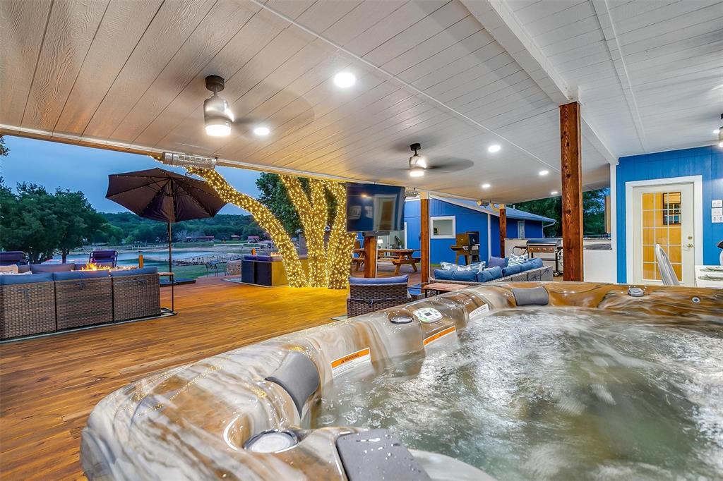 520 Deer Trail Gordon, TX 76453 - Photo 36 of 40 Living area featuring wood ceiling, wood finished floors, ceiling fan, and recessed lighting