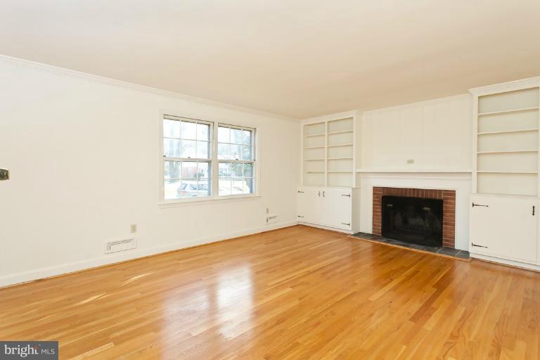 7916 Ruxway Road Towson, MD 21204 - Photo 6 of 20 Living Room w/built-in & wood-burning fireplace