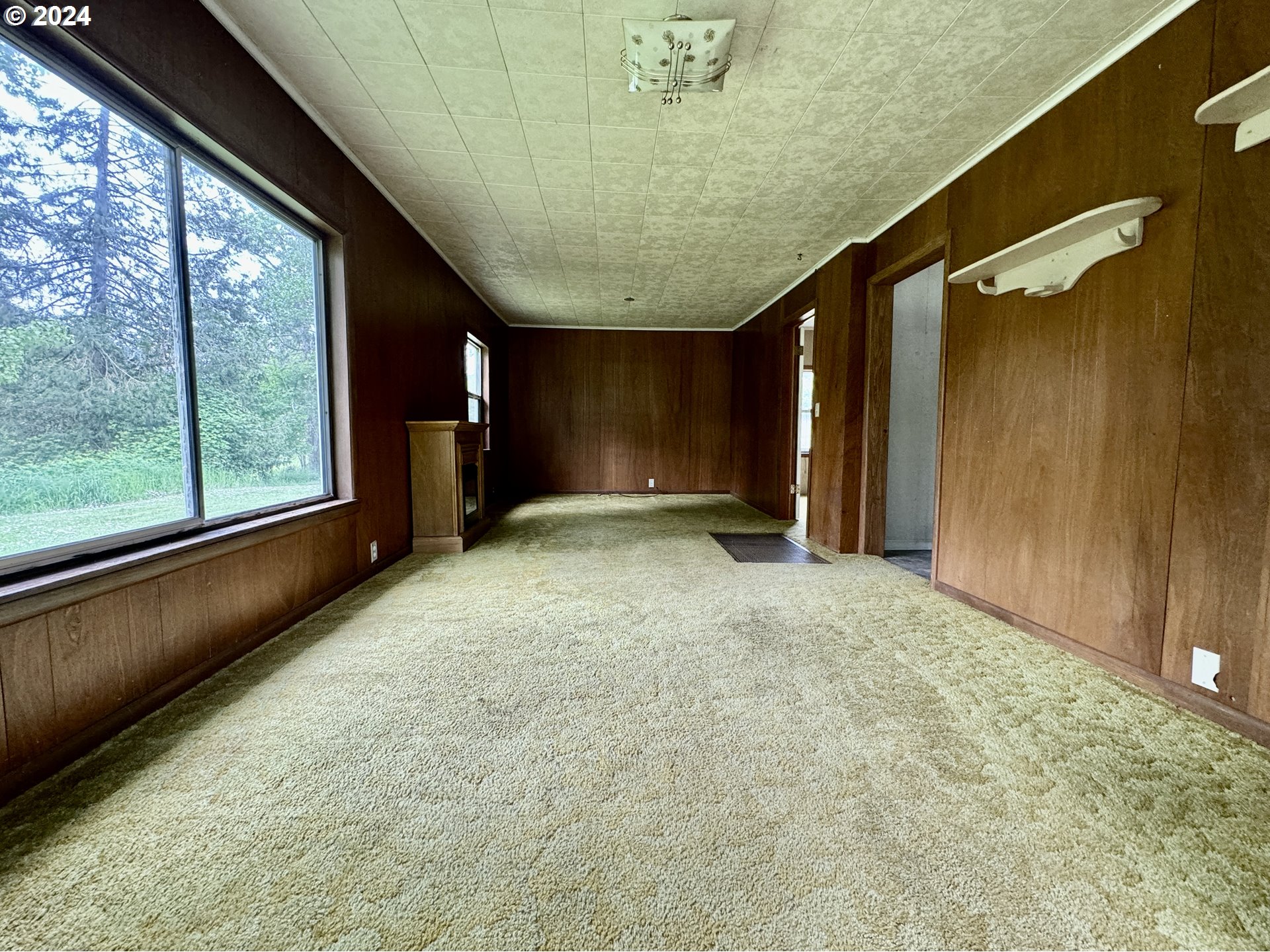 210 Winter Green Drive Riddle, OR 97469 - Photo 17 of 30 a view of a room with a large window