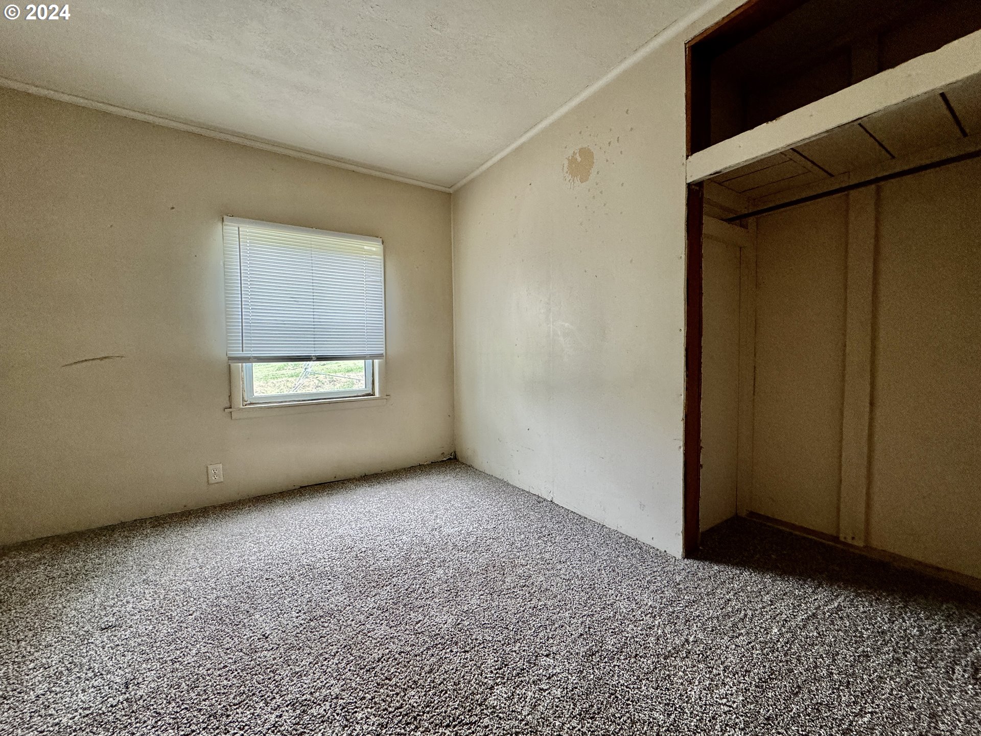 210 Winter Green Drive Riddle, OR 97469 - Photo 19 of 30 a view of an empty room with windows