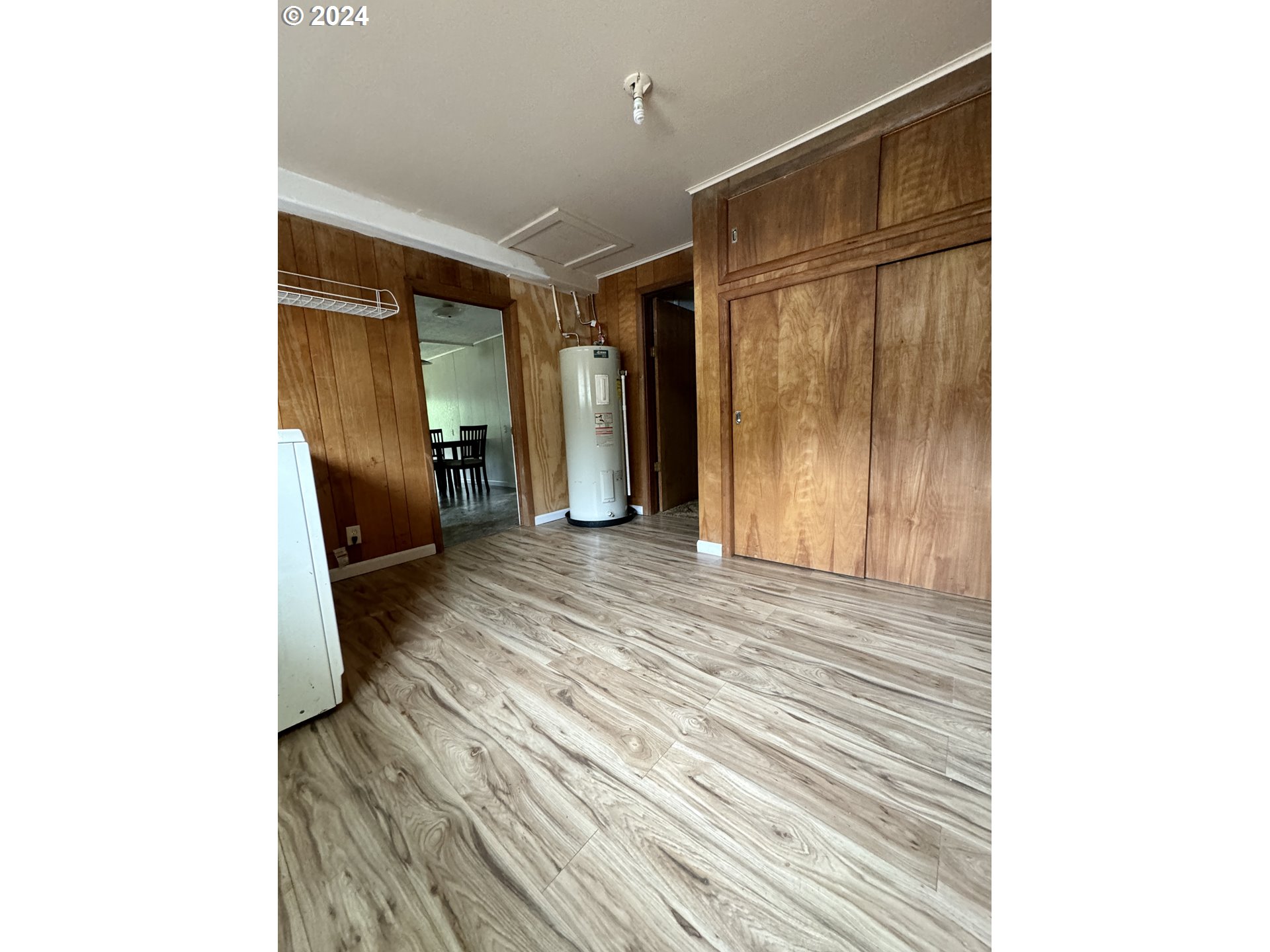 210 Winter Green Drive Riddle, OR 97469 - Photo 7 of 30 a view of a room with wooden floor and furniture