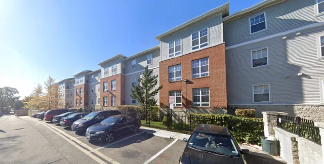 a view of multiple houses with a yard