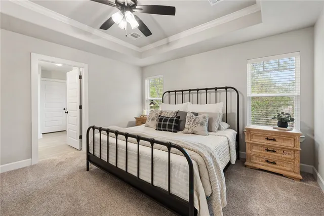 a bed room with a bed and a window