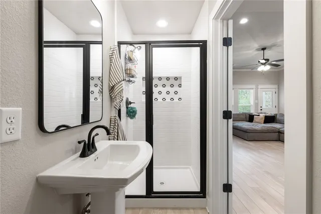 a en suite bathroom with a sink and a mirror
