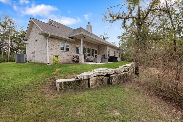 a view of a house with a yard porch and sitting area