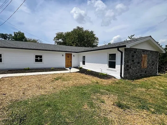 a house view with a backyard space
