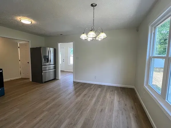 a view of a livingroom with wooden floor