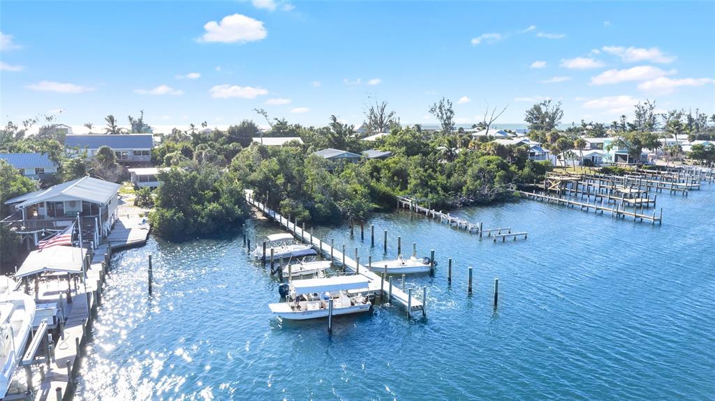 8668 Grand Avenue Boca Grande, FL 33921 - Photo 13 of 17 a view of a swimming pool and lounge chairs