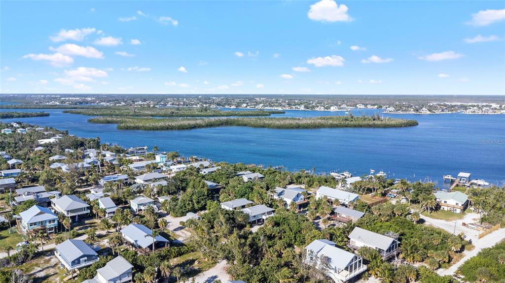 8668 Grand Avenue Boca Grande, FL 33921 - Photo 15 of 17 an aerial view of a house with a swimming pool outdoor seating and yard