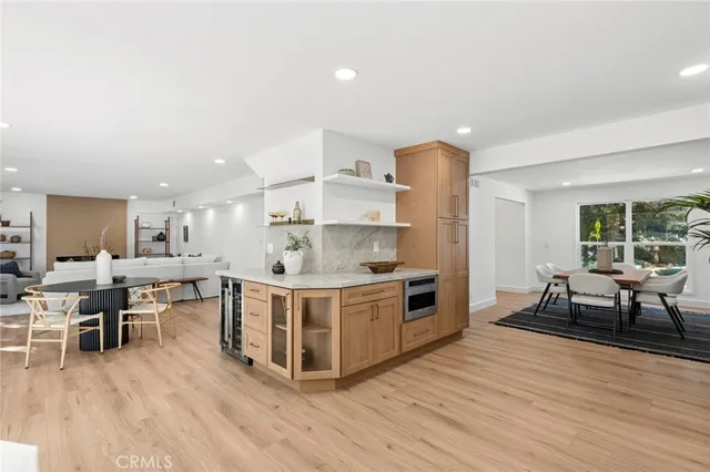 a kitchen with a table and chairs in it