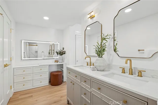 a bathroom with a double vanity sink and a mirror