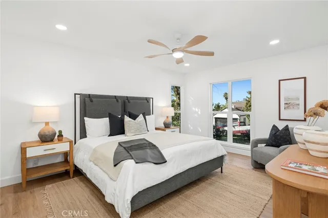 a bedroom with a bed and a couch