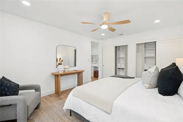 a bedroom with a bed and a dresser