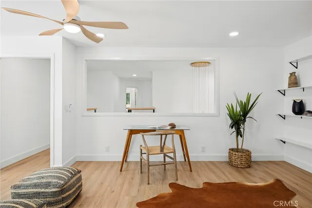a view of room with furniture and wooden floor