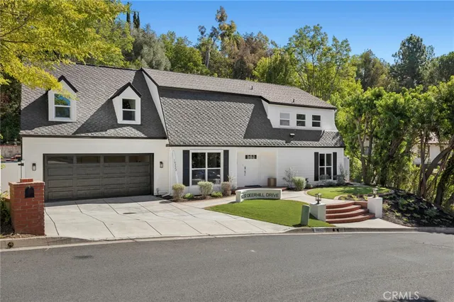 a aerial view of a house with a yard
