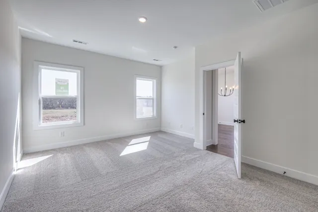 a bathroom with double sink and a mirror