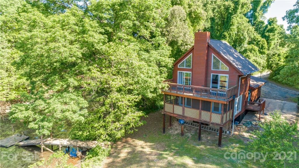 5349 Charlotte Highway Lake Wylie, SC 29710 - Photo 1 of 35 a view of a house with brick walls and a small yard