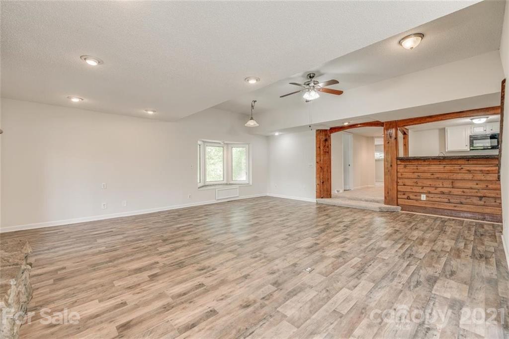 5349 Charlotte Highway Lake Wylie, SC 29710 - Photo 11 of 35 an empty room with wooden floor and windows