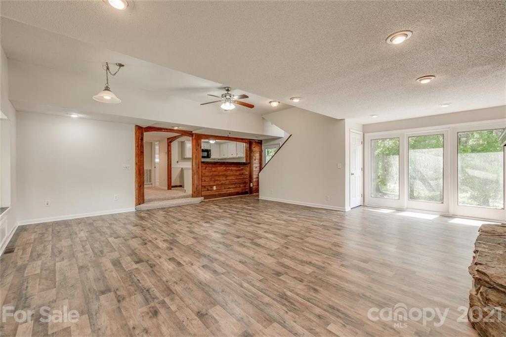 5349 Charlotte Highway Lake Wylie, SC 29710 - Photo 20 of 35 a view of an empty room with a window and wooden floor