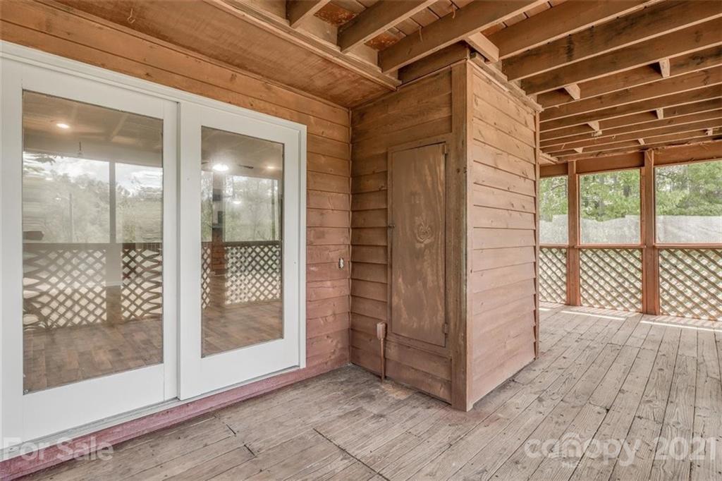 5349 Charlotte Highway Lake Wylie, SC 29710 - Photo 22 of 35 a view of a room with wooden floor and large windows