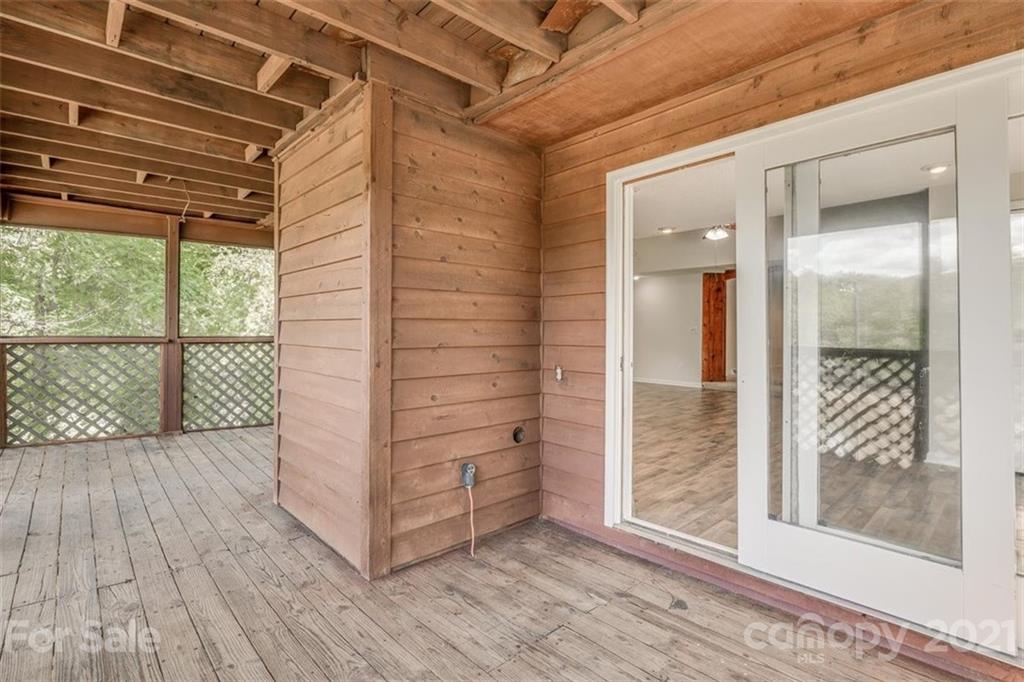 5349 Charlotte Highway Lake Wylie, SC 29710 - Photo 23 of 35 a view of a hallway with wooden floor and a glass door