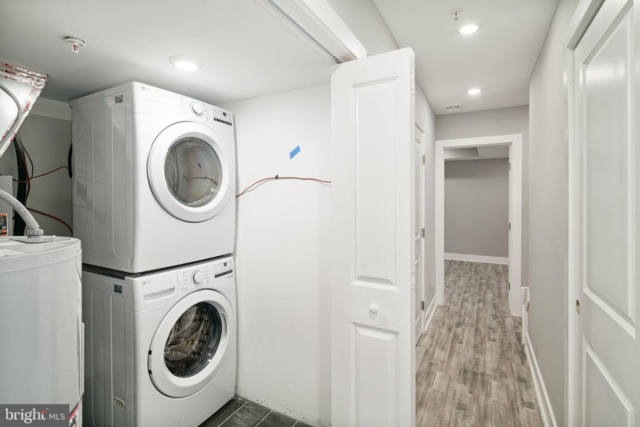 1443 North 8th Street, Unit 2 Philadelphia, PA 19122 - Photo 17 of 18 a view of a hallway with washer and dryer