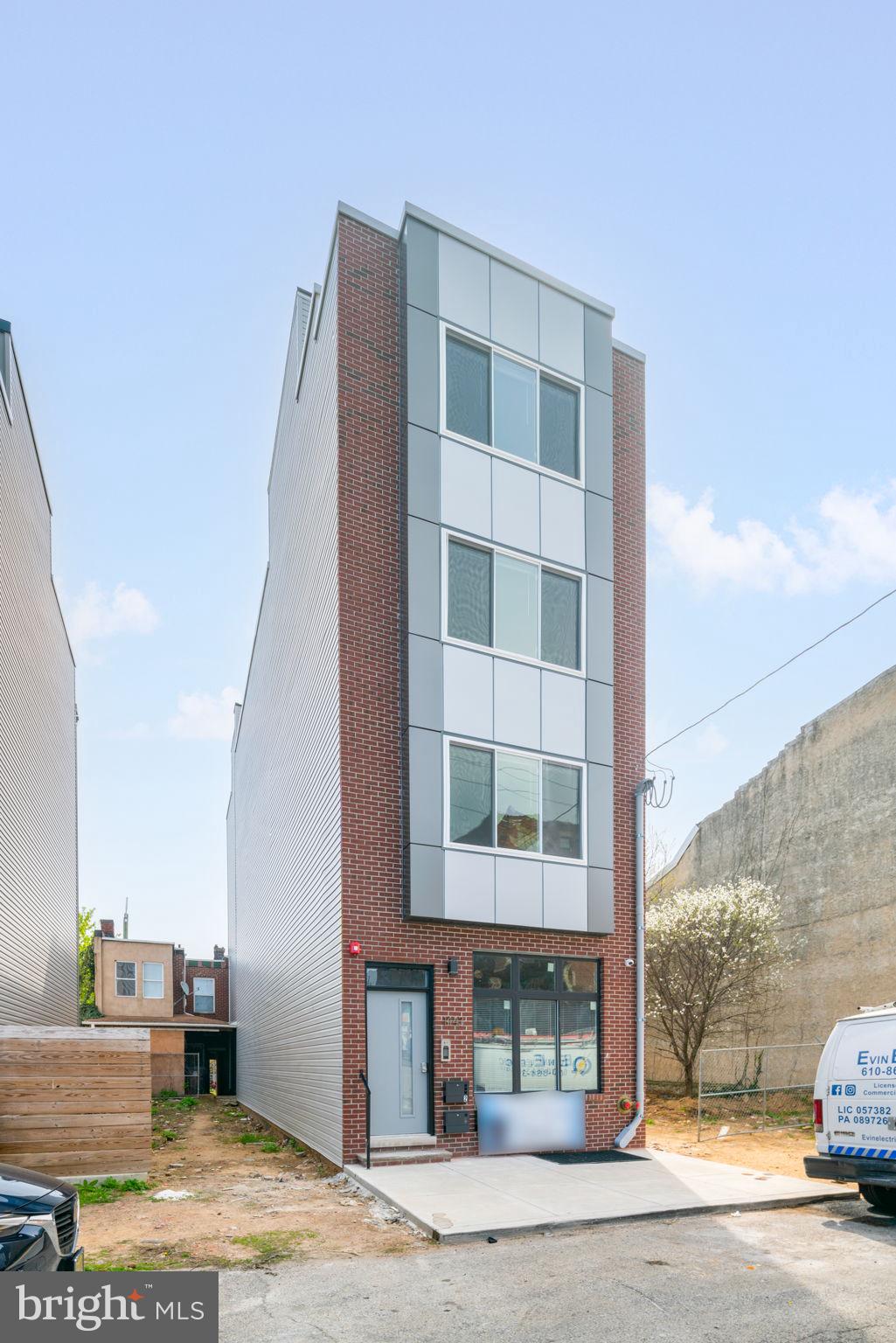 1443 North 8th Street, Unit 2 Philadelphia, PA 19122 - Photo 18 of 18 a tall building with a window
