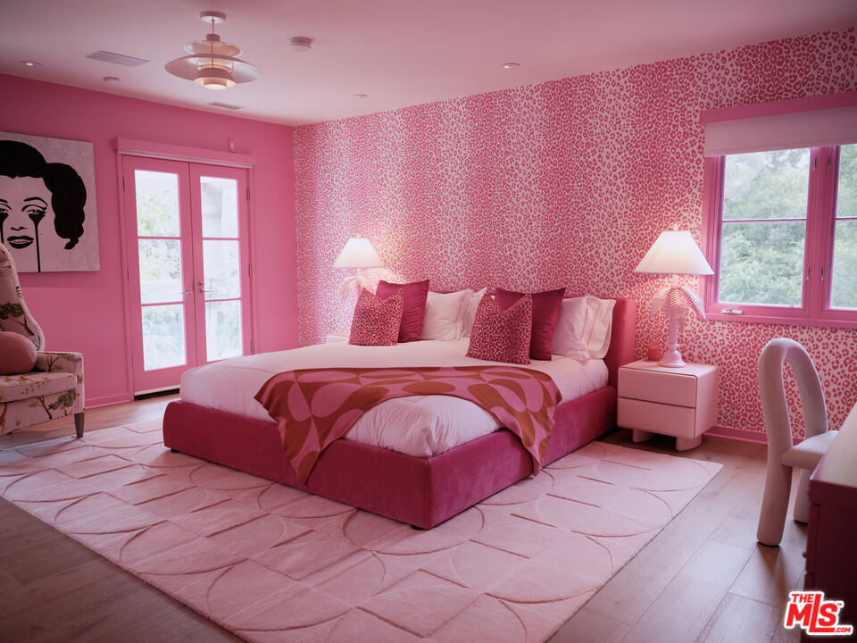 661 Doheny Road Beverly Hills, CA 90210 - Photo 12 of 28 a bedroom with a bed and a couch