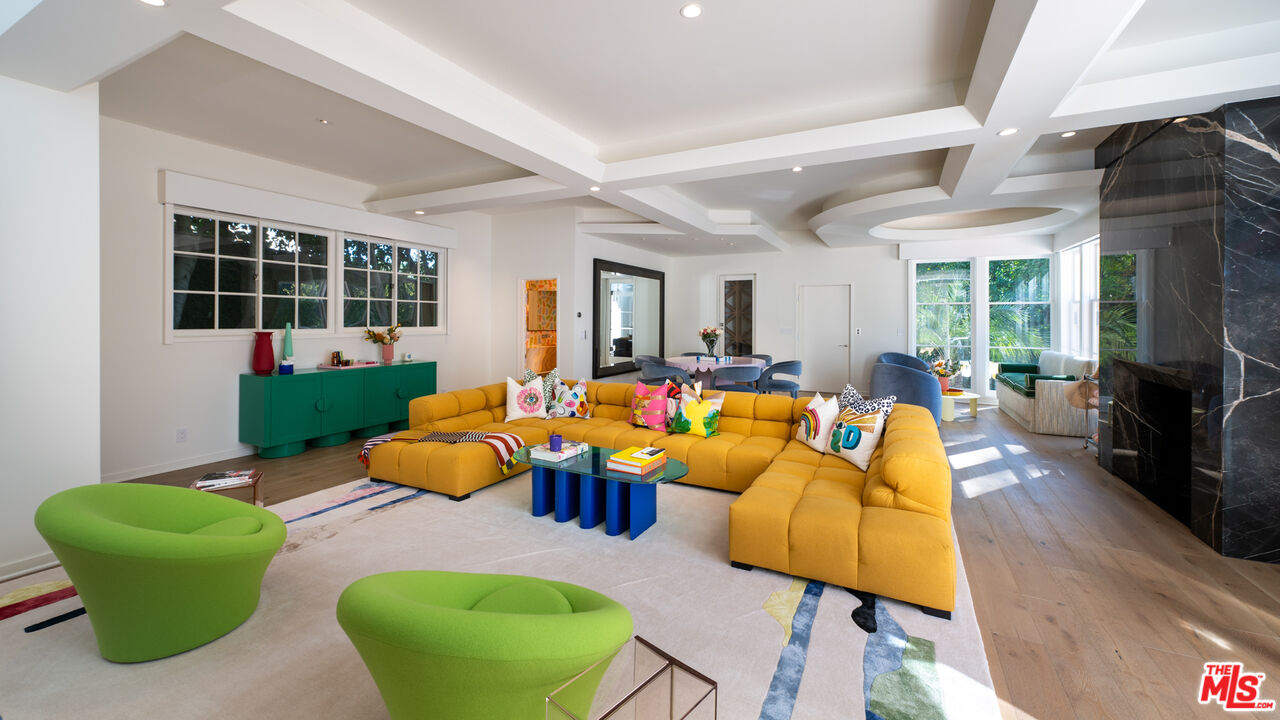 661 Doheny Road Beverly Hills, CA 90210 - Photo 13 of 33 a living room with furniture fireplace and window