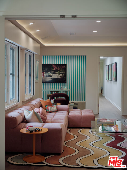 661 Doheny Road Beverly Hills, CA 90210 - Photo 14 of 28 a living room with furniture and a large window