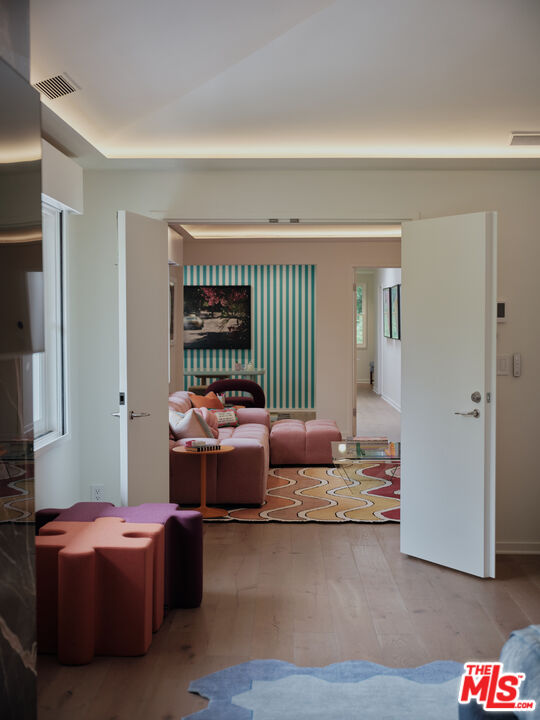 661 Doheny Road Beverly Hills, CA 90210 - Photo 15 of 28 a living room with furniture and a rug