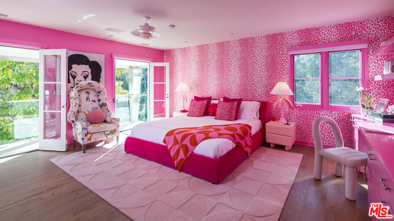 661 Doheny Road Beverly Hills, CA 90210 - Photo 16 of 33 a bedroom with a bed mirror and a window