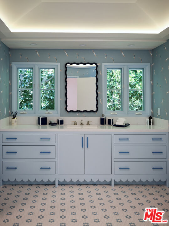 661 Doheny Road Beverly Hills, CA 90210 - Photo 17 of 28 a kitchen with sink window and mirror