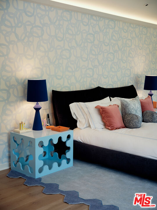 661 Doheny Road Beverly Hills, CA 90210 - Photo 18 of 28 a bedroom with a bed and lamp