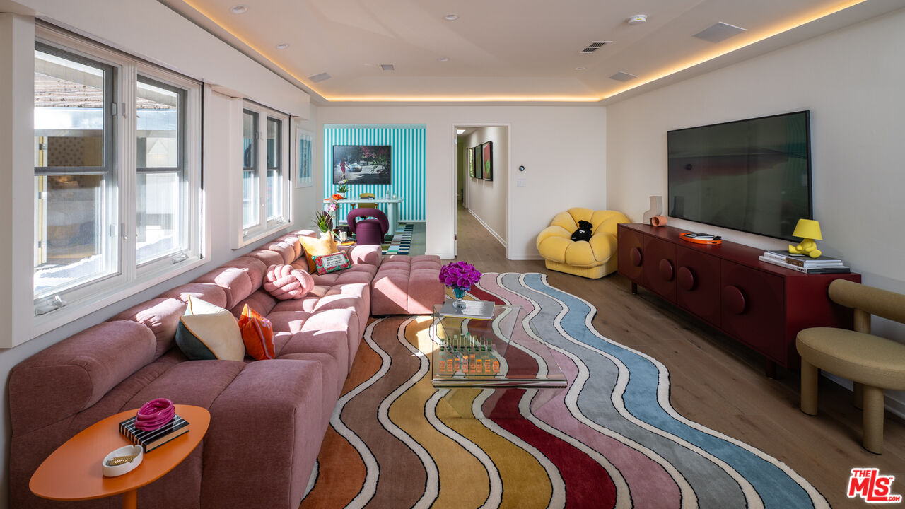 661 Doheny Road Beverly Hills, CA 90210 - Photo 18 of 33 a living room with furniture and a flat screen tv