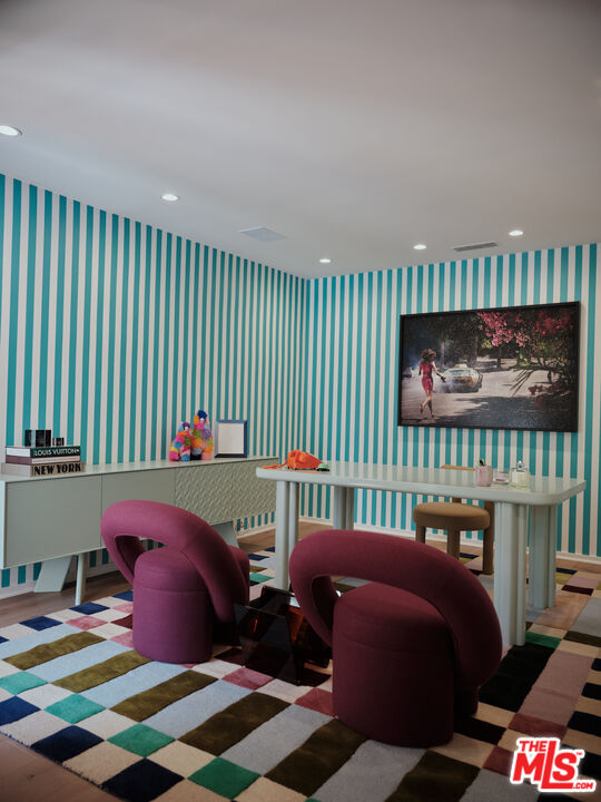 661 Doheny Road Beverly Hills, CA 90210 - Photo 20 of 33 a bedroom with furniture and a window