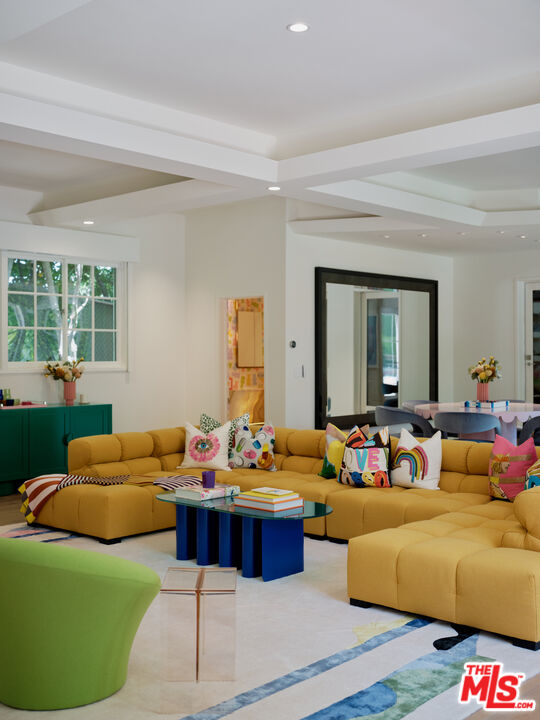 661 Doheny Road Beverly Hills, CA 90210 - Photo 2 of 28 a living room with furniture and a large window