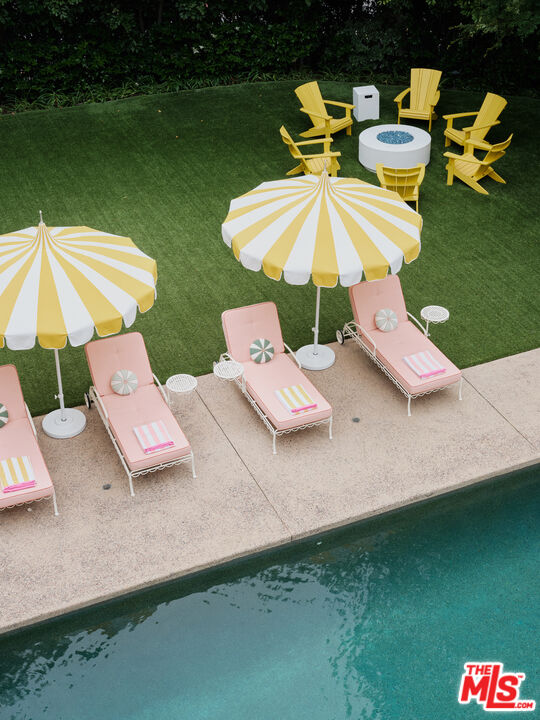 661 Doheny Road Beverly Hills, CA 90210 - Photo 22 of 28 a view of a lake with couches and swimming pool