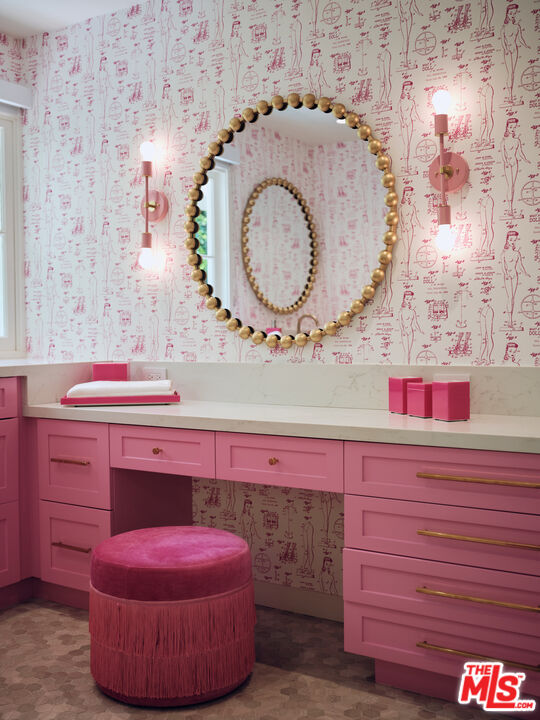 661 Doheny Road Beverly Hills, CA 90210 - Photo 23 of 33 a bathroom with a sink and a mirror