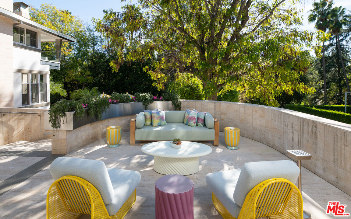 661 Doheny Road Beverly Hills, CA 90210 - Photo 3 of 33 a view of a table and chairs in patio