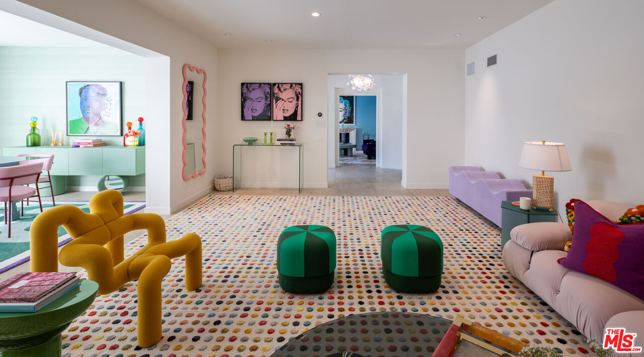 661 Doheny Road Beverly Hills, CA 90210 - Photo 5 of 33 a living room with furniture and a table