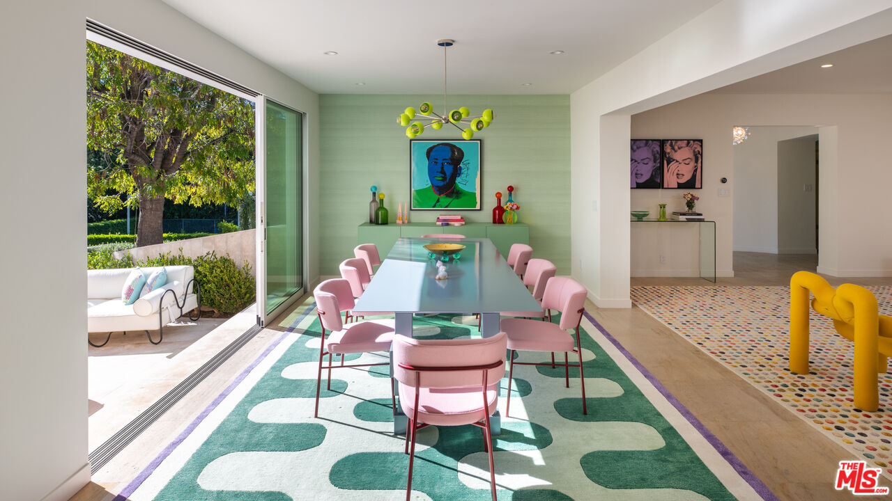 661 Doheny Road Beverly Hills, CA 90210 - Photo 6 of 33 a living room with furniture and a large window