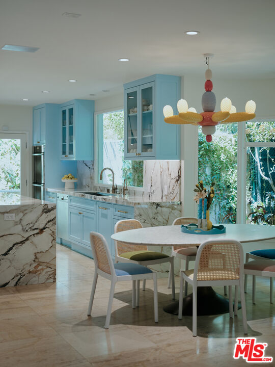 661 Doheny Road Beverly Hills, CA 90210 - Photo 6 of 28 a dinning area with furniture and kitchen view