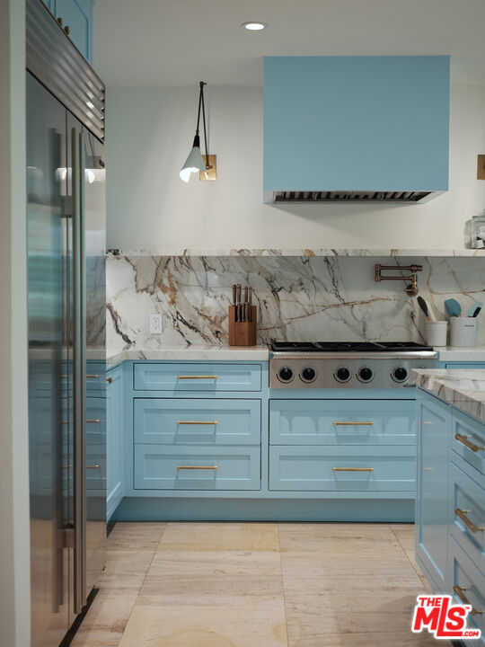 661 Doheny Road Beverly Hills, CA 90210 - Photo 7 of 28 a kitchen with a stove and a shower