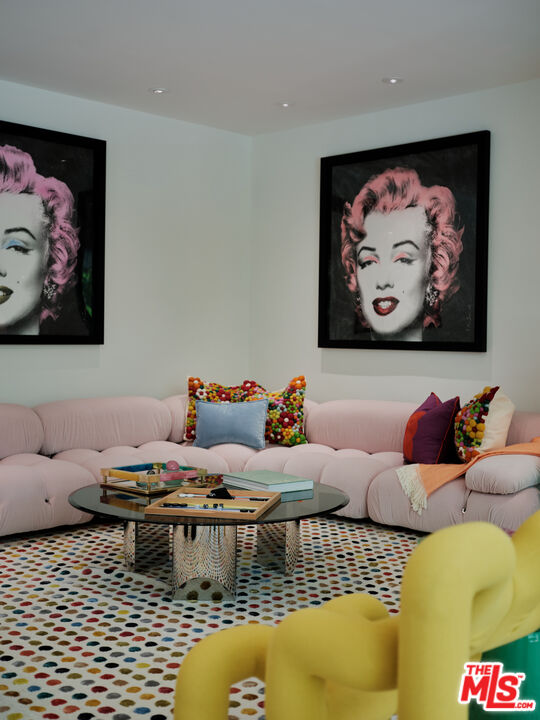 661 Doheny Road Beverly Hills, CA 90210 - Photo 8 of 28 a living room with furniture and wall paintings